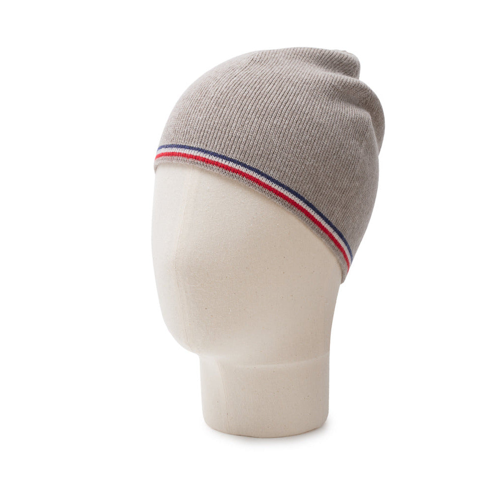 Gray knit beanie with red white and blue stripe on a mannequin head against a white background