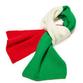 Knitted scarf with red, green, and white sections on a white background