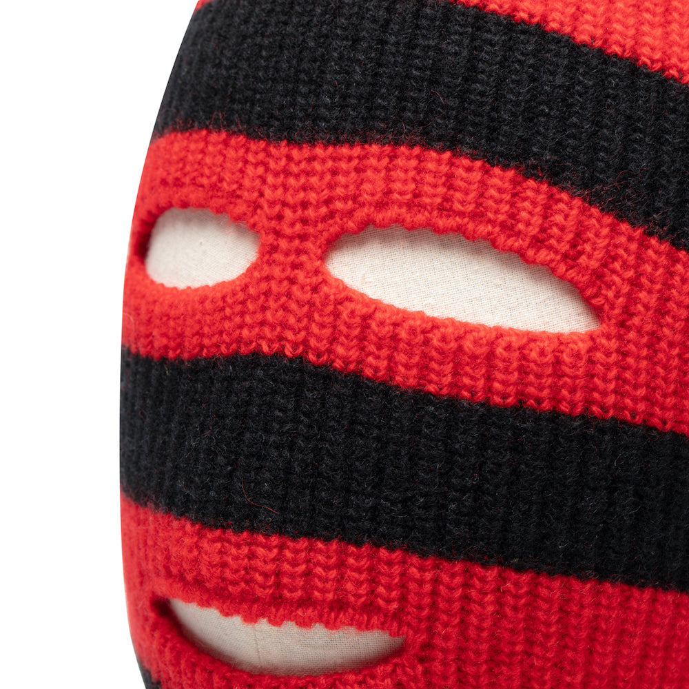 Close-up of red and black striped knitted balaclava