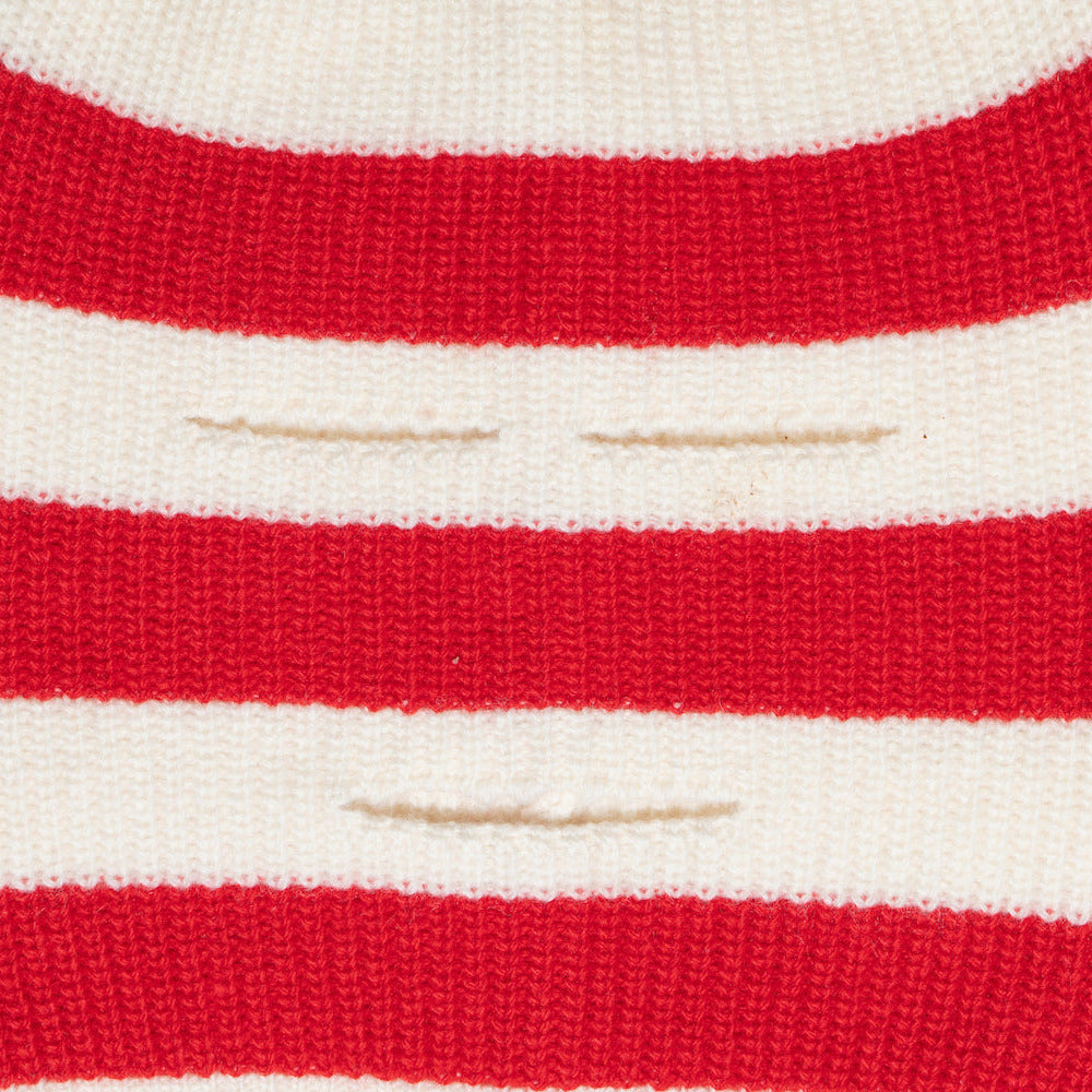 Close-up of red and white striped knitted balaclava
