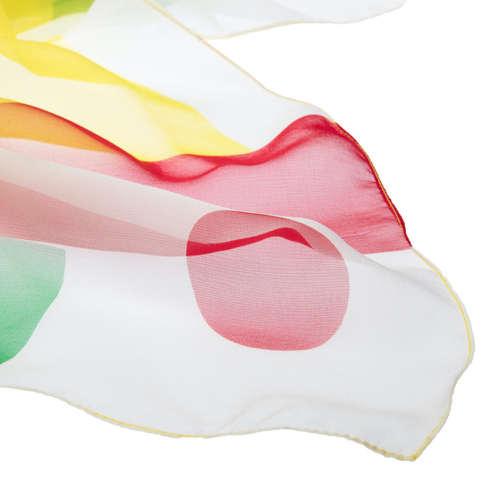 Colorful fabric with a red dot on a white background