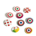 Nine colorful round buttons with various target and polka dot patterns, arranged on a plain white background.