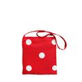 Red bag with white polka dots on a white background