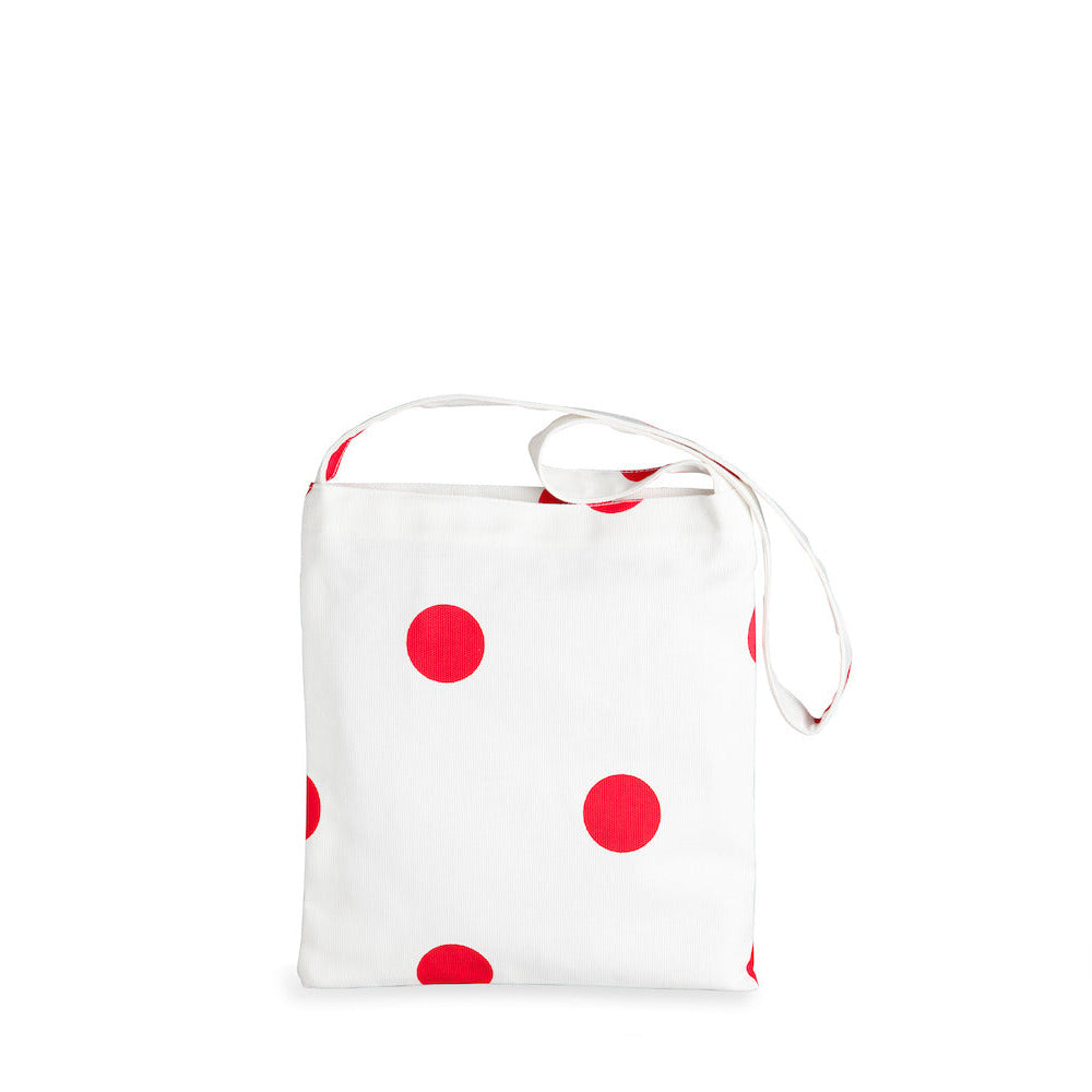 White pouch with red polka dots on a white background