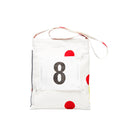 White bag with red dots and tyvek number 8 on a white background