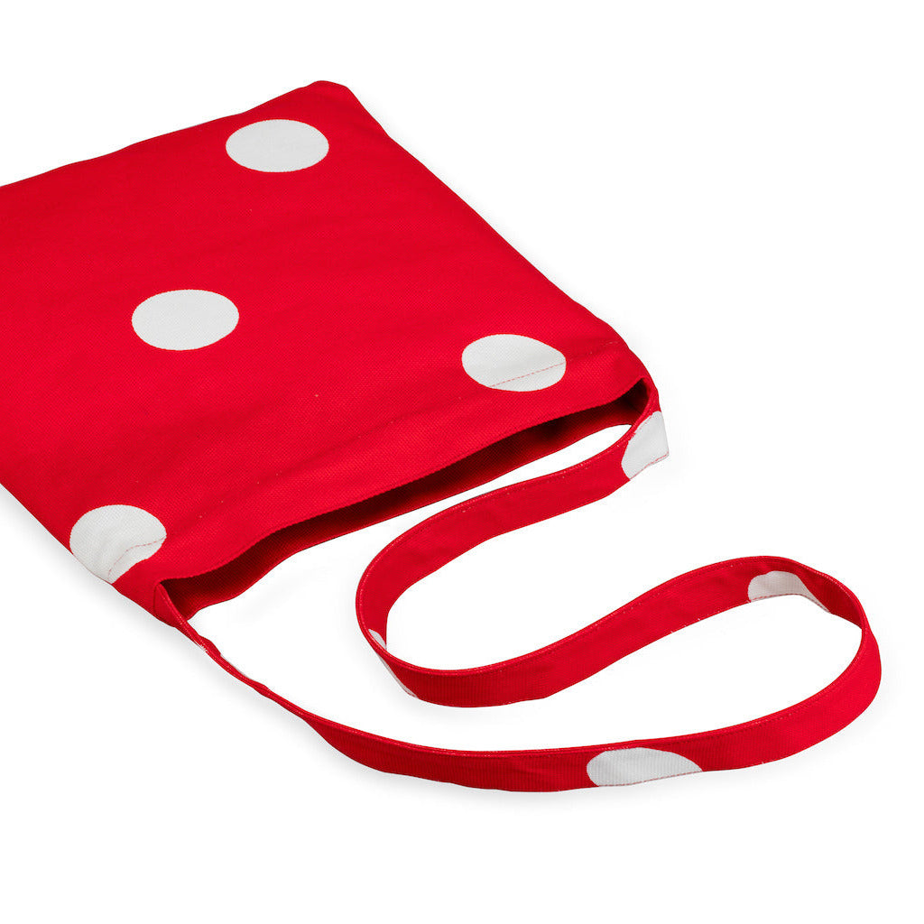 Red bag with white polka dots on a white background