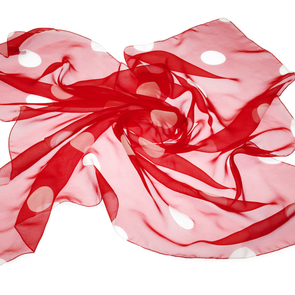 Red polka dot silk foulard on a white background