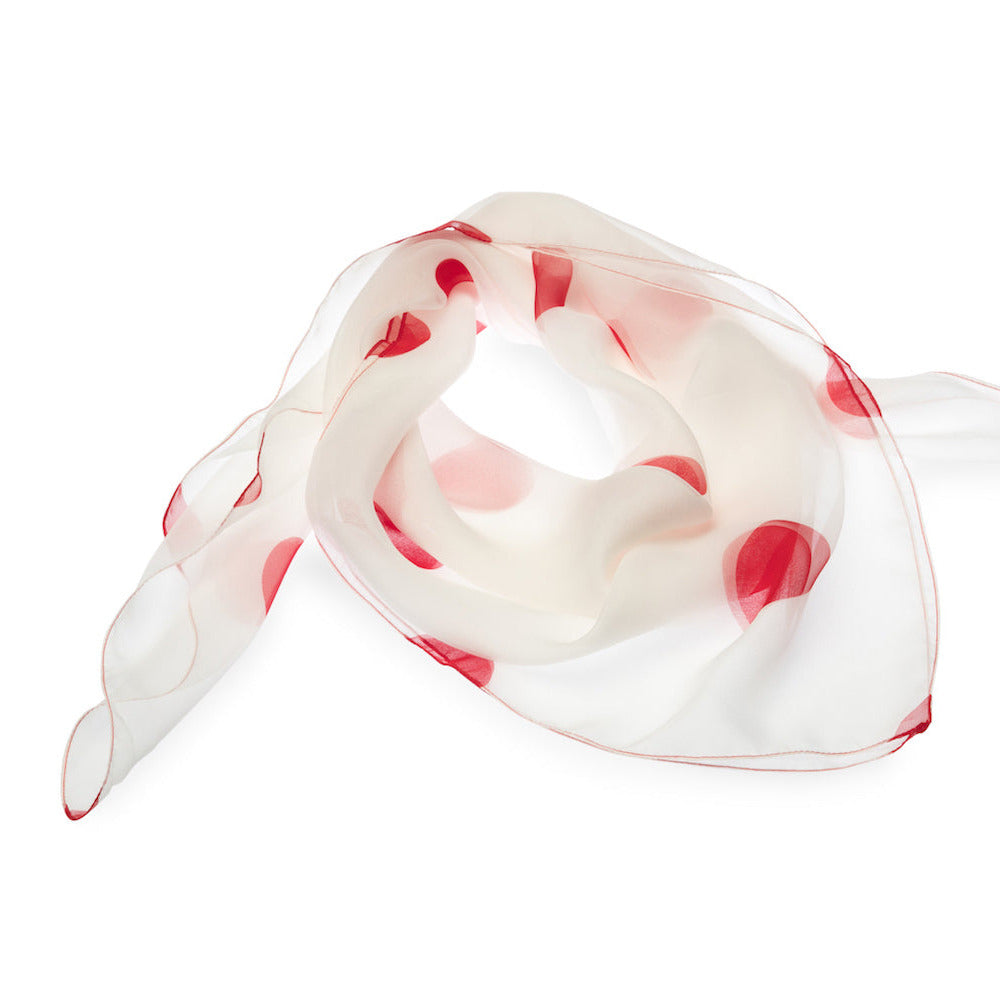 White silk scarf with red polka dots on a white background