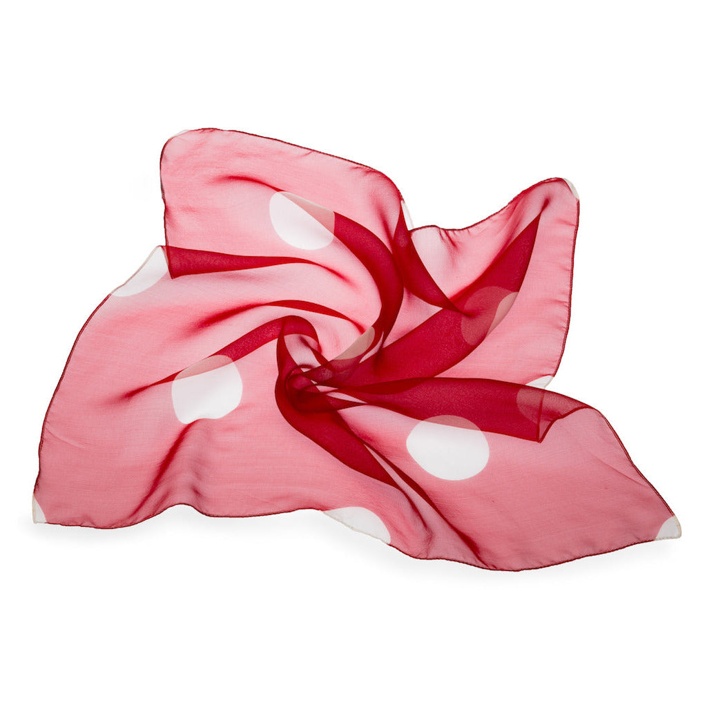 Red scarf with white polka dots on a white background
