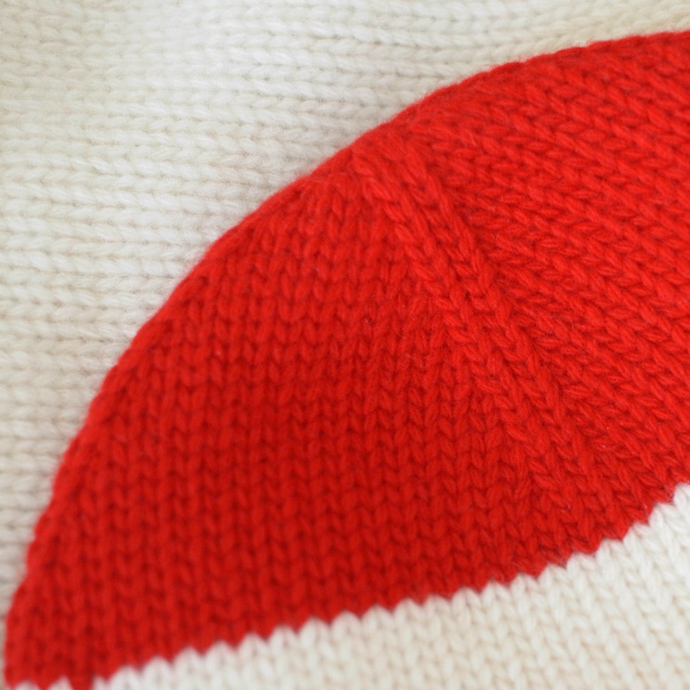 Close-up of a red and white knitted fabric