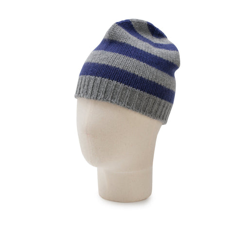 Knitted beanie with blue and gray stripes on a mannequin head against a white background