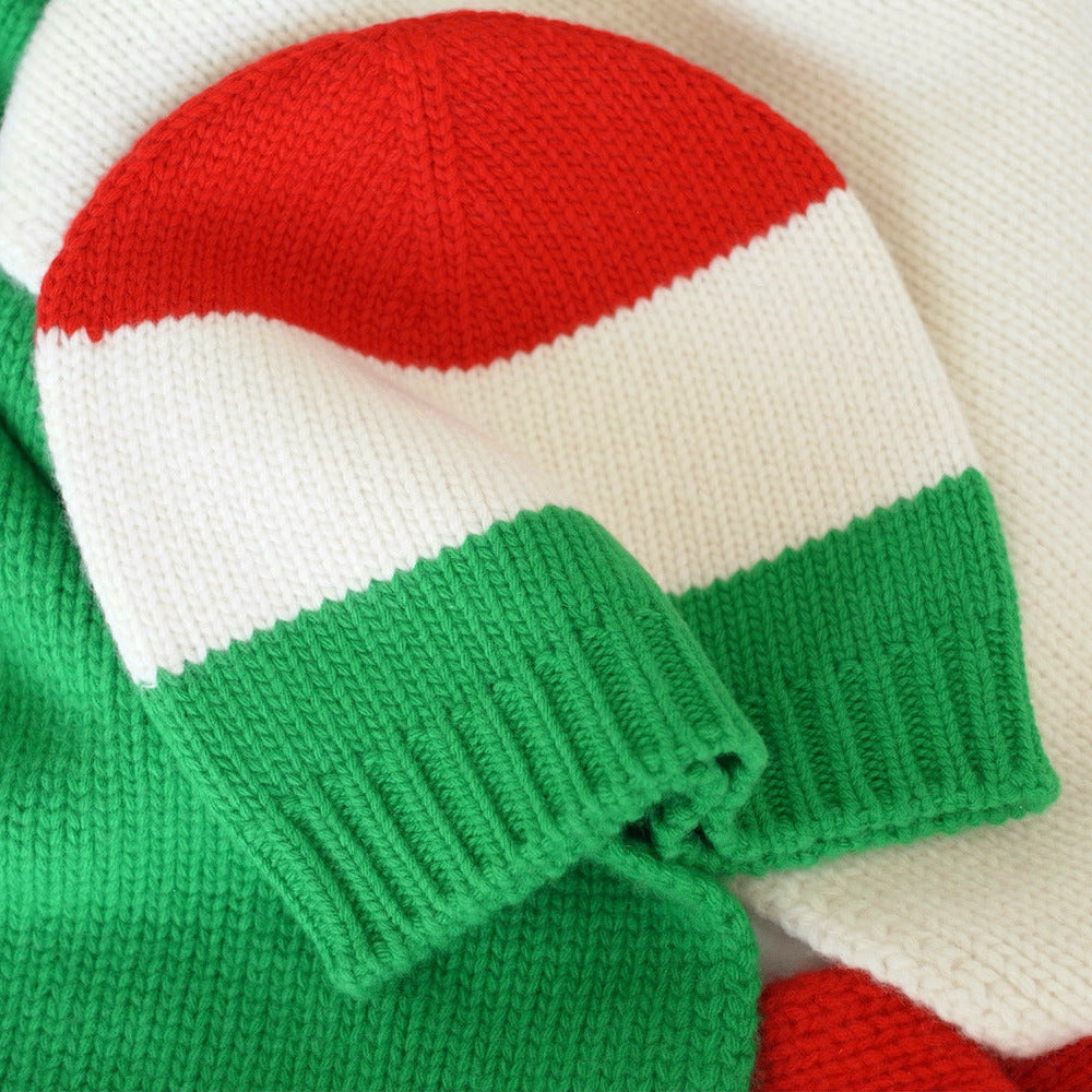Knitted hat and scarf set with red, white, and green colors.